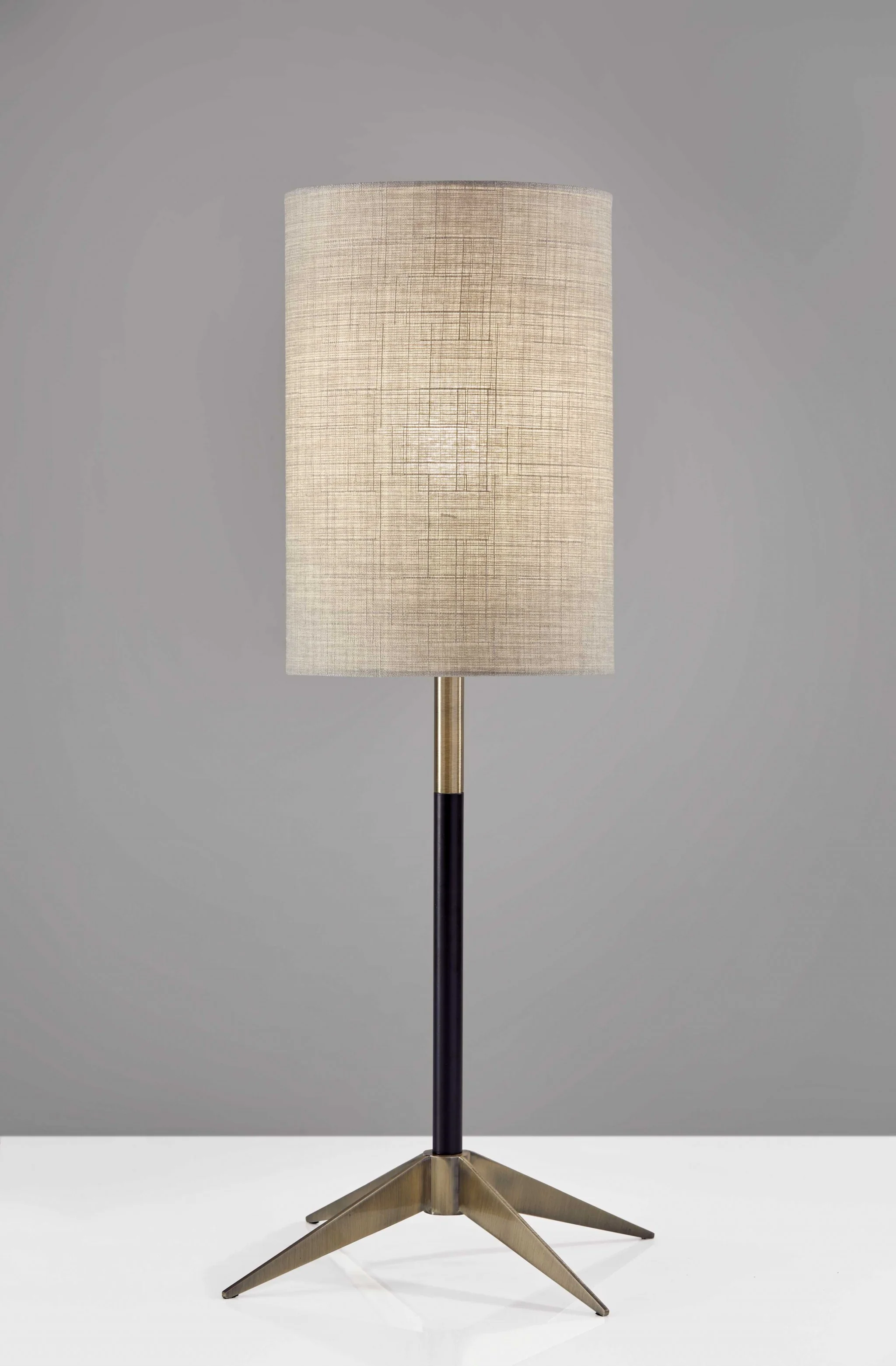 Antique Brass Metal Tripod Base with Matte Black Accent and Tall Natural Fabric Shade Table Lamp By Homeroots
