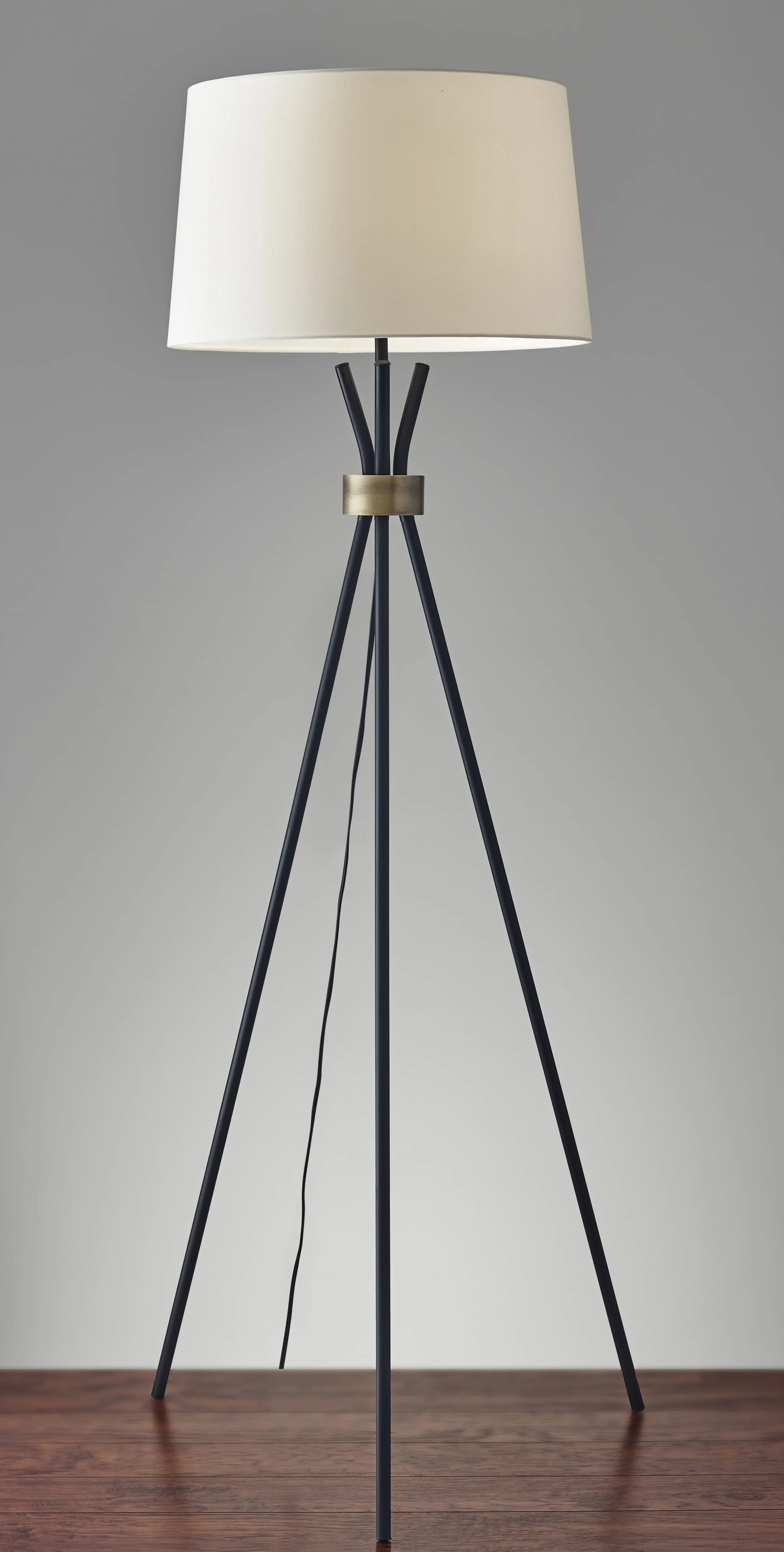 Black Metal Tripod Leg Floor Lamp with Antique Brass Accent By Homeroots