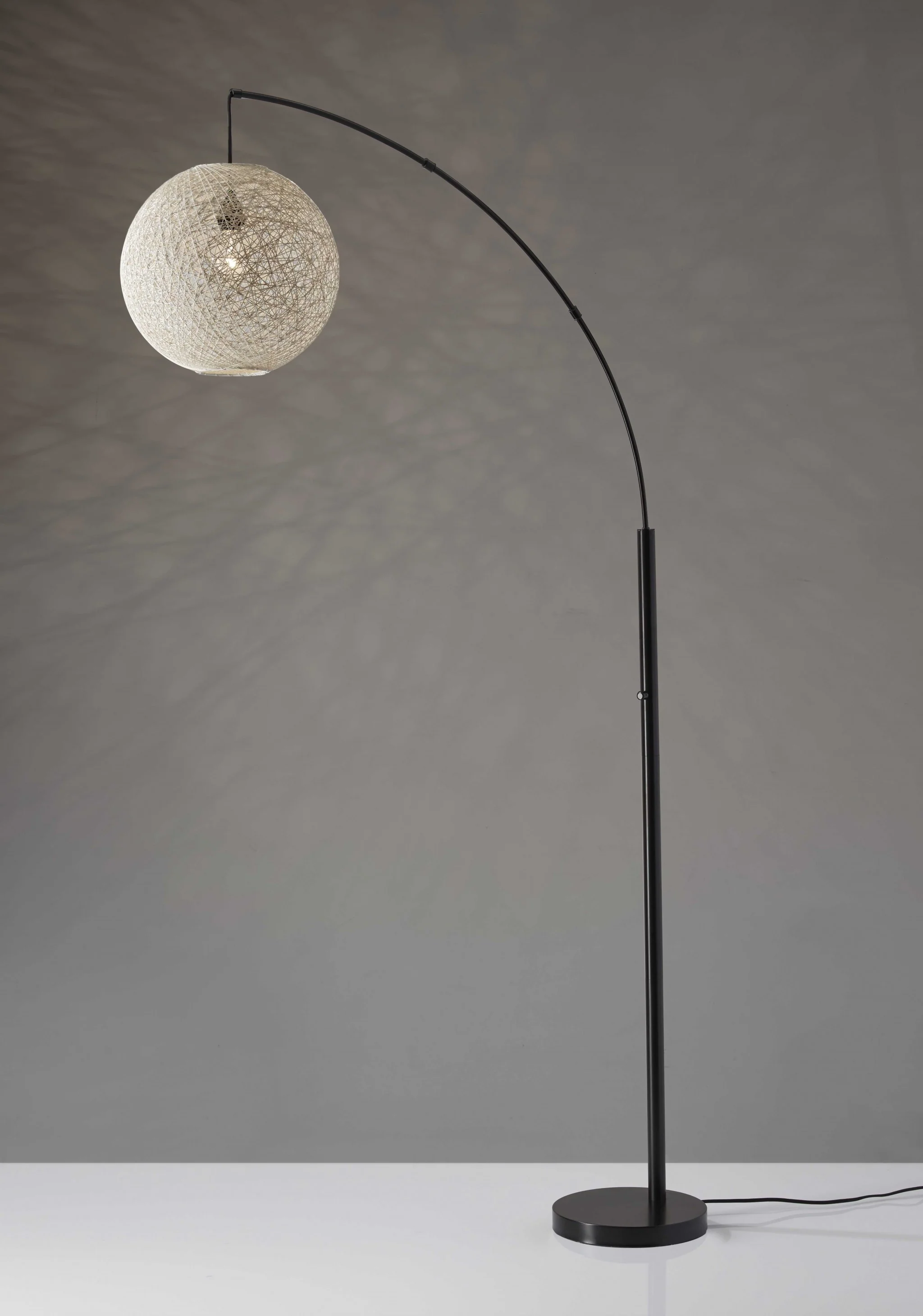 Floor Lamp with Bronze Metal Arc and Groovy Rattan String Ball Shade By Homeroots