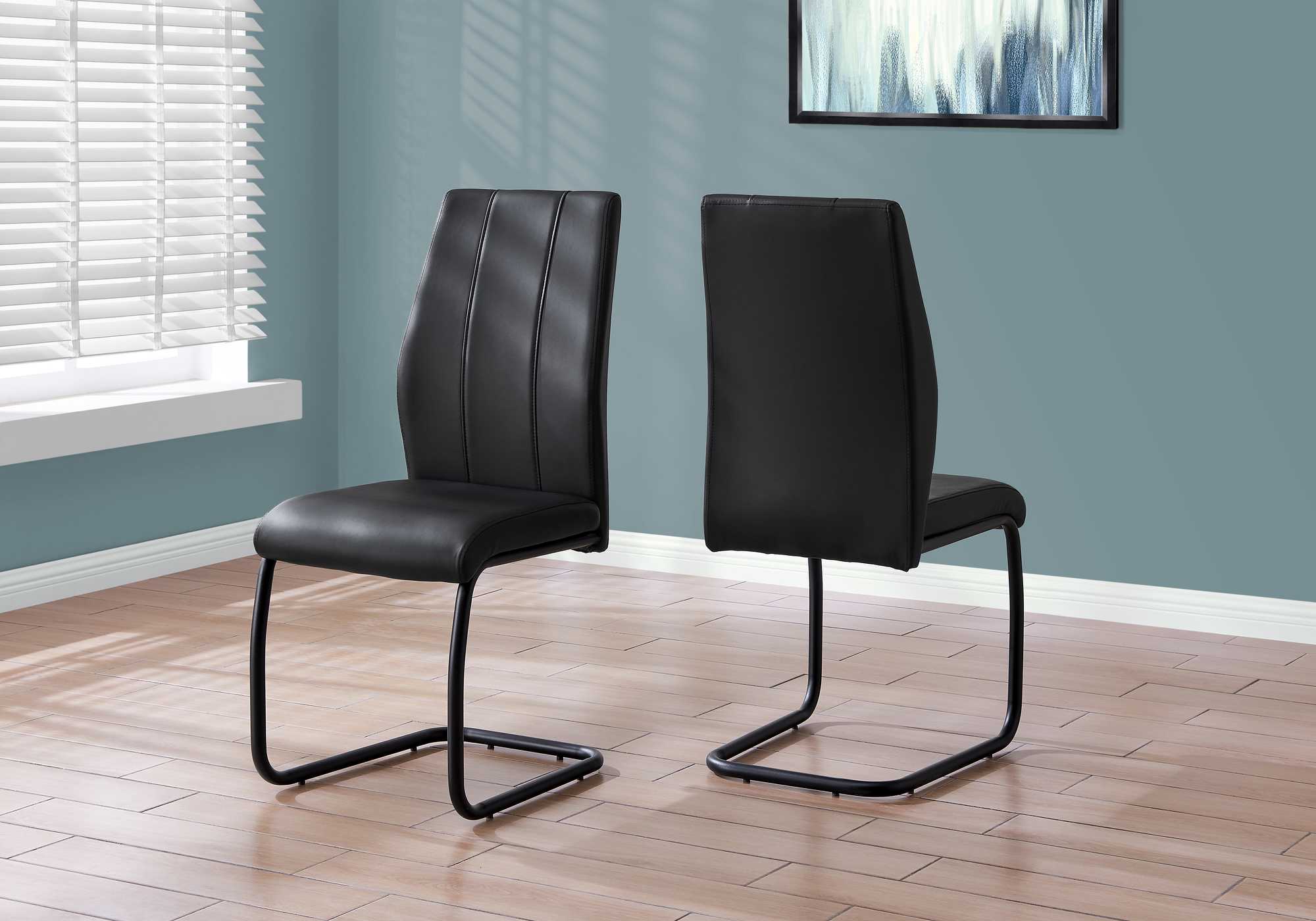 Two 77.5" Black Leather Look Chrome Metal And Foam Dining Chairs By Homeroots